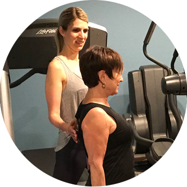 Dr Tina coaching older fitness client